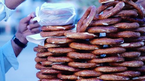 Cropped hand of man holding food