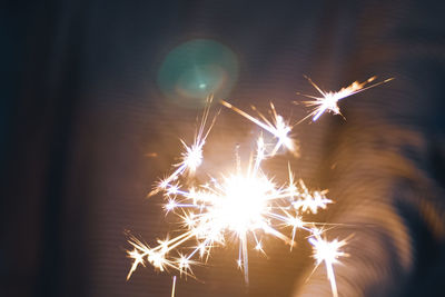 Close-up of firework display at night