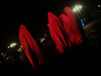 Close-up of illuminated red lights at night