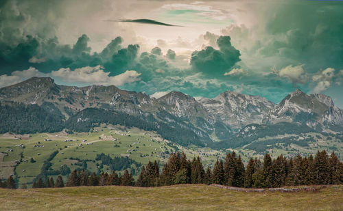 Scenic view of landscape and mountains against sky