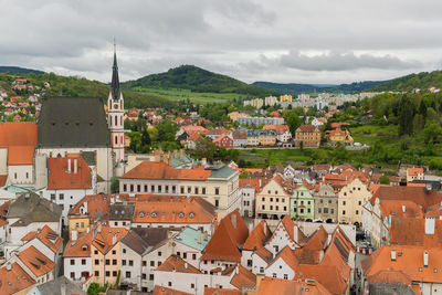 Houses in town against sky