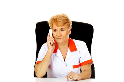 Portrait of woman against white background