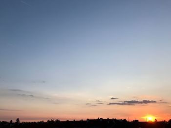 Scenic view of silhouette landscape against sky at sunset