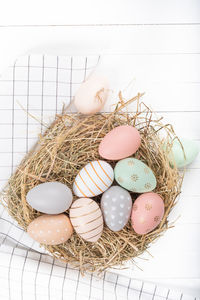 High angle view of eggs in basket on table