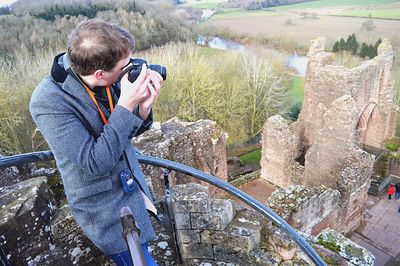 High angle view of photographer at old historic goodrich castle