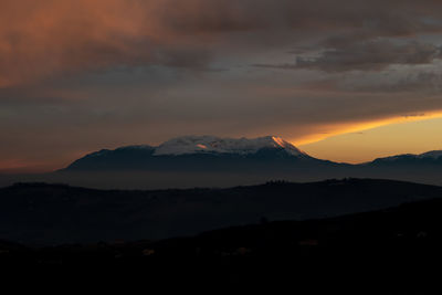 Scenic view of dramatic sky during sunset