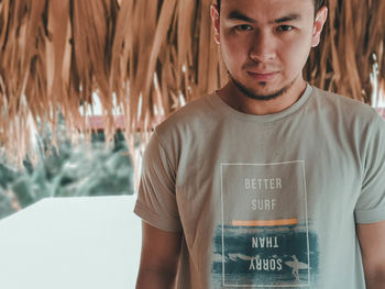 Portrait of young man standing outdoors