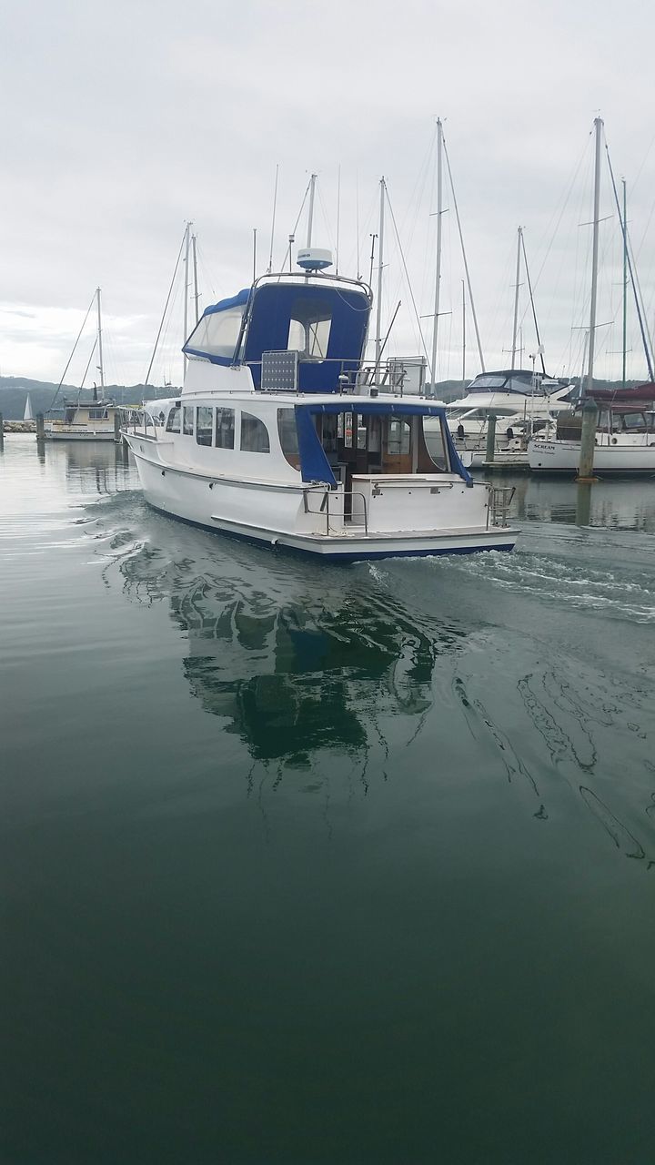 nautical vessel, transportation, water, moored, boat, mode of transport, sky, harbor, mast, sea, waterfront, sailboat, cloud - sky, travel, tranquility, river, nature, outdoors, reflection, day