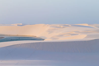 Scenic view of snowcapped landscape against sky