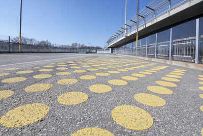 Surface level of road against sky in city