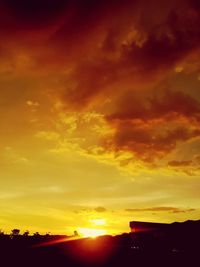 Scenic view of dramatic sky during sunset