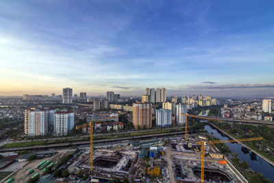 High angle view of city buildings against sky