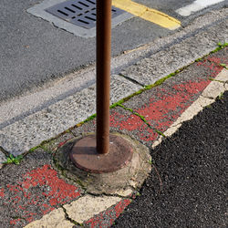 High angle view of road sign on street