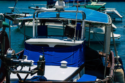 Boats moored at harbor