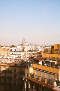 High angle view of buildings against clear sky