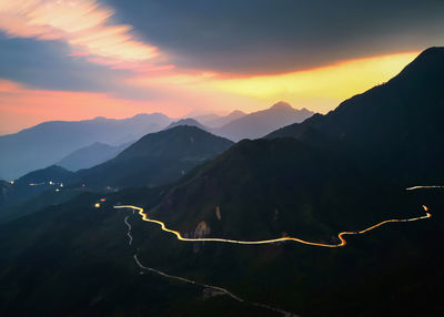 Scenic view of mountains against sky during sunset