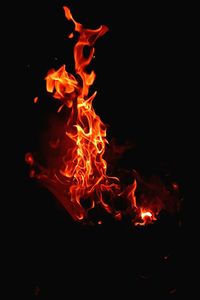 Close-up of fire against black background