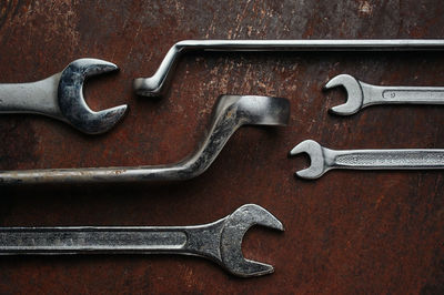 Close-up of rusty metal tools on table