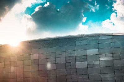 Low angle view of building against cloudy sky