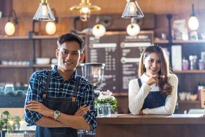 Portrait of a smiling young woman at restaurant