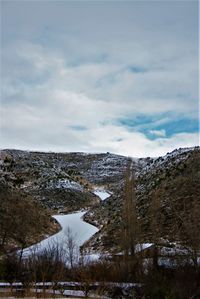 Scenic view of snowcapped landscape against sky