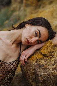 Young woman holding sand