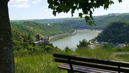 Scenic view of landscape with burg katz ans rhine river against sky