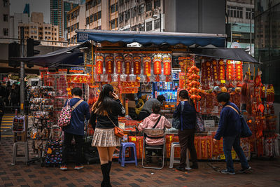 People at street market in city