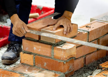 Midsection of man working at workshop