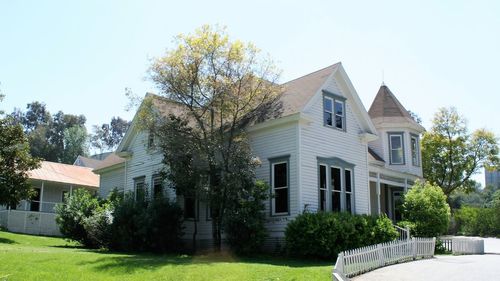 Lawn by house against clear sky