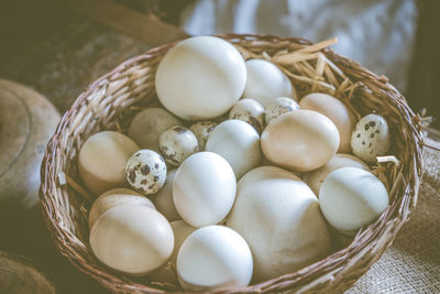 Close-up of eggs in basket on table