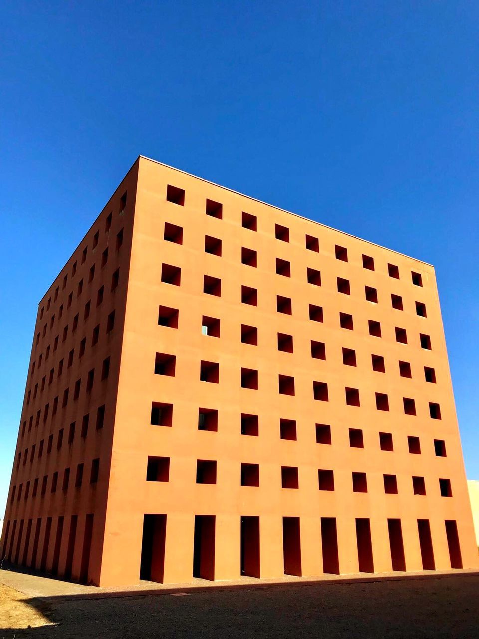 MODERN BUILDING AGAINST CLEAR SKY