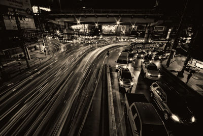 High angle view of light trails on road at night