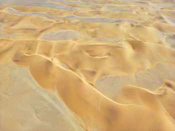 Full frame shot of sand at sandy beach