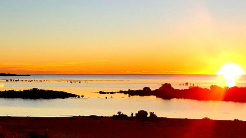 Scenic view of sea at sunset