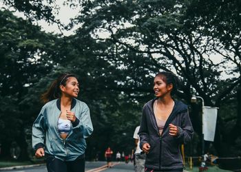 Smiling young women in park 