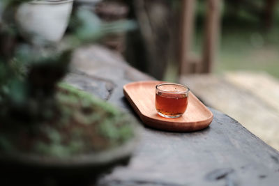Romantic morning. wooden tea table, tea cup. interior green tones. high quality photo