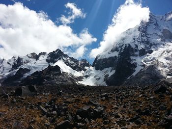 Scenic view of snowcapped mountains against sky