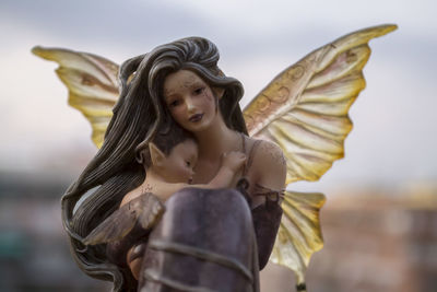 Close-up of statue against sky