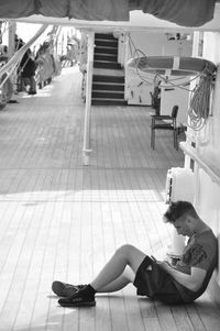 High angle view of woman sitting on floor