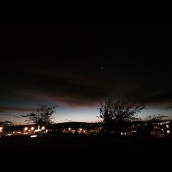 Scenic view of landscape against sky at night