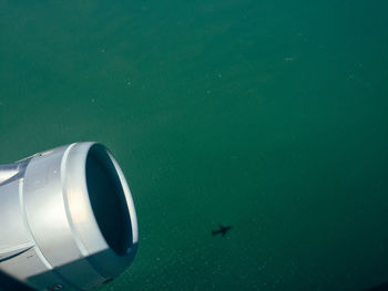 Close-up of airplane flying over water