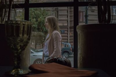Rear view of woman sitting on seat