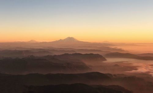 Scenic view of mountains against sky during sunset