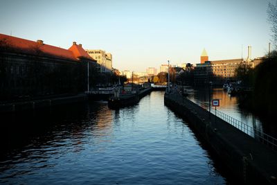 View of bridge over river in city