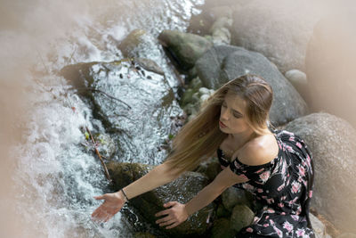 Woman looking at waterfall