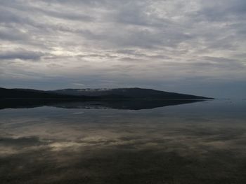 Scenic view of lake against sky during sunset