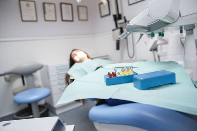 Close-up of dental equipment on table in clinic