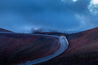 Scenic view of mountain road against sky