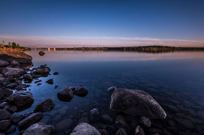 Scenic view of lake at sunset